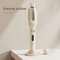Aura Wave automatic hair curler showing rotating styling design